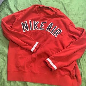 Red Nike crew neck bought from the Nike store for 80 plus tax good condition